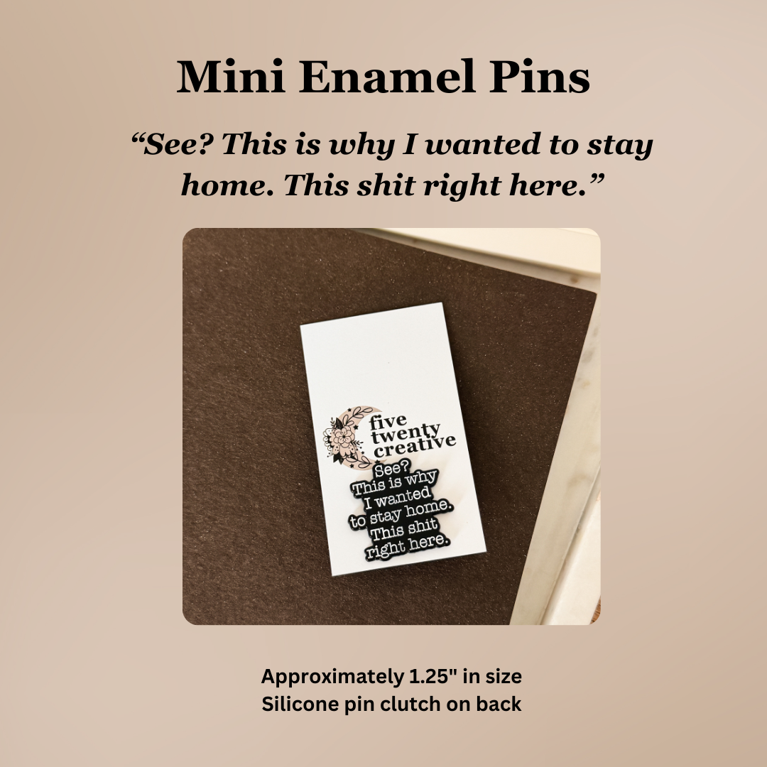 Mini enamel pin with text on a brown card against a beige background